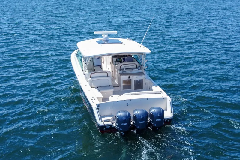 Slide: The Image of 2015 Grady-White Freedom 375 boat cruising on open water. - 7