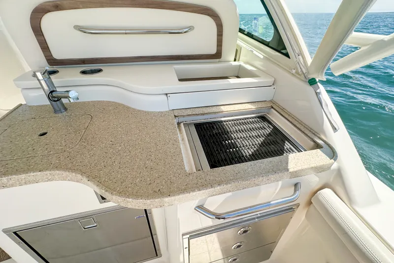 Slide: The Image of Luxurious 2015 Grady-White Freedom 375 boat kitchen with sink and grill, ocean view. - 42