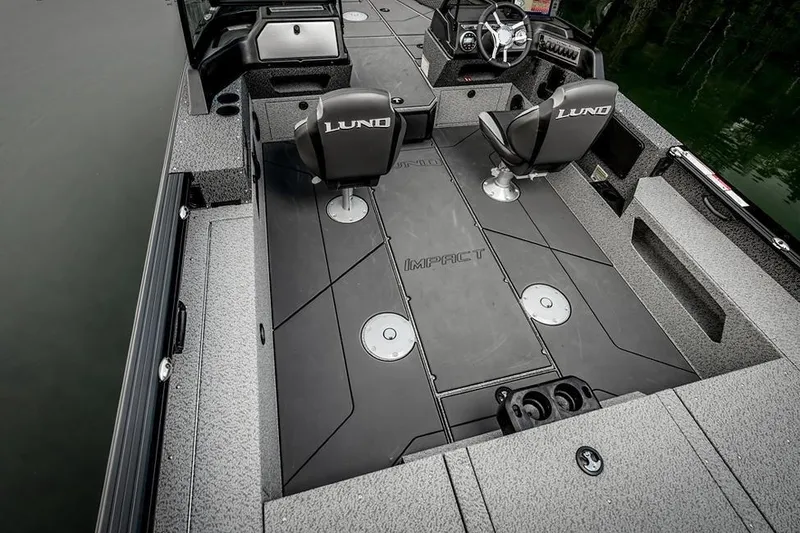 Slide: The Image of Manufacturer Provided Image: 2026 Lund 2075 Impact XS boat interior with seating and steering console. - 8
