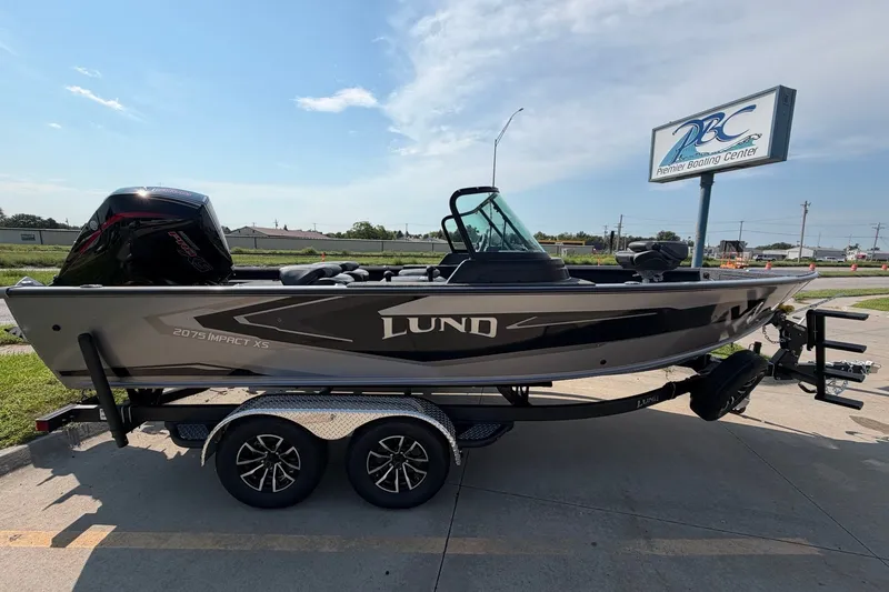 The Image of 2027 Lund 2075 Impact XS boat on trailer at Premier Boating Center. - 0