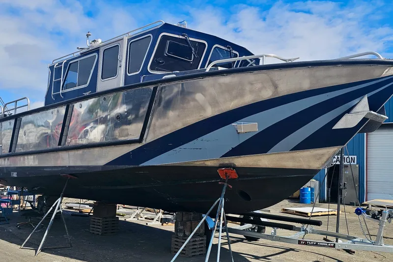 The Image of 2019 Armstrong Marine 38 Monohull Aluminum boat on dry dock, showcasing sleek design. - 1