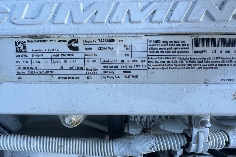 Slide: The Image of Label on Cummins engine detailing specifications for Armstrong Marine 38 Monohull Aluminum, 2019 model. - 22