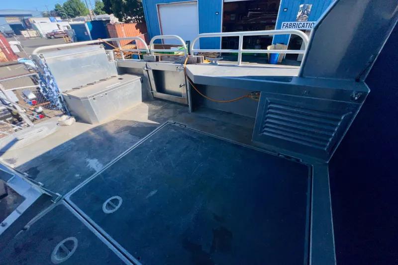 Slide: The Image of 2019 Armstrong Marine 38 Monohull Aluminum boat deck with storage and railing. - 5
