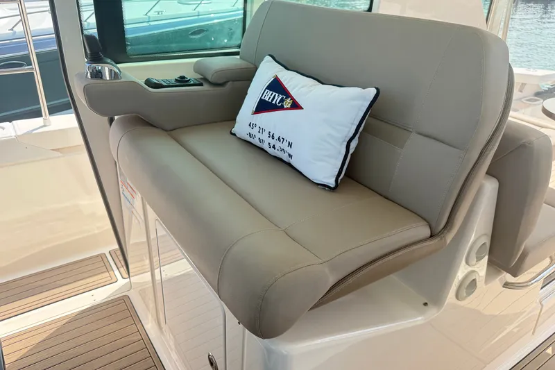Slide: The Image of Luxurious seating on 2016 Tiara Yachts Q44 with nautical-themed pillow. - 19