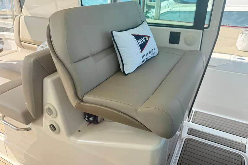 Slide: The Image of Luxurious seating on 2016 Tiara Yachts Q44 with decorative pillow. - 20