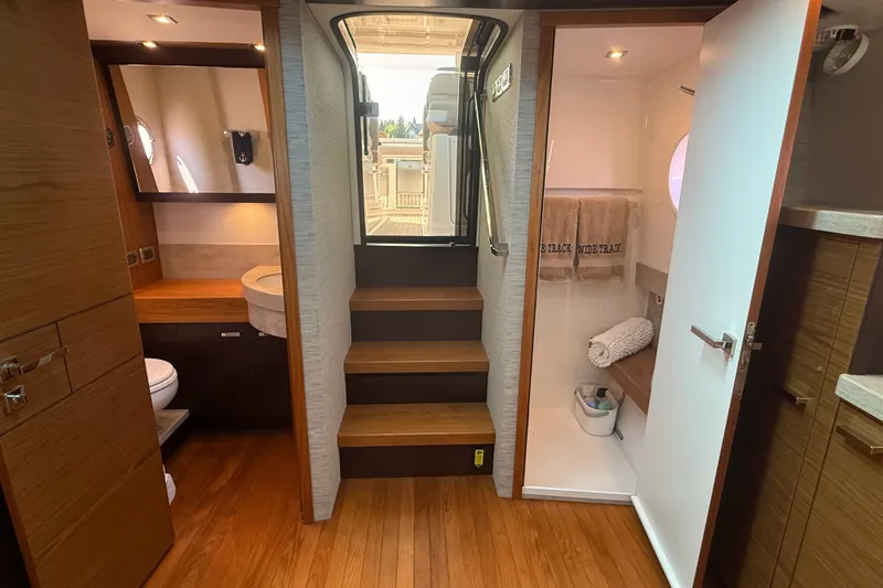 Slide: The Image of Luxurious 2016 Tiara Yachts Q44 interior with wooden flooring and modern bathroom amenities. - 34