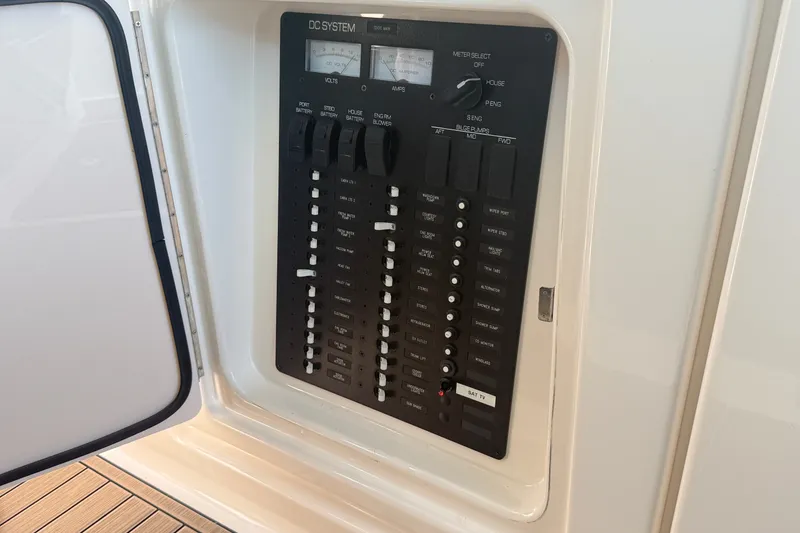 Slide: The Image of Electrical panel on a 2016 Tiara Yachts Q44, showcasing DC system controls. - 24