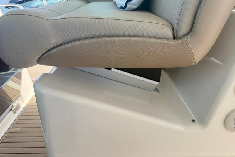 Slide: The Image of Captain's seat on 2016 Tiara Yachts Q44, showcasing luxurious design and comfort. - 18