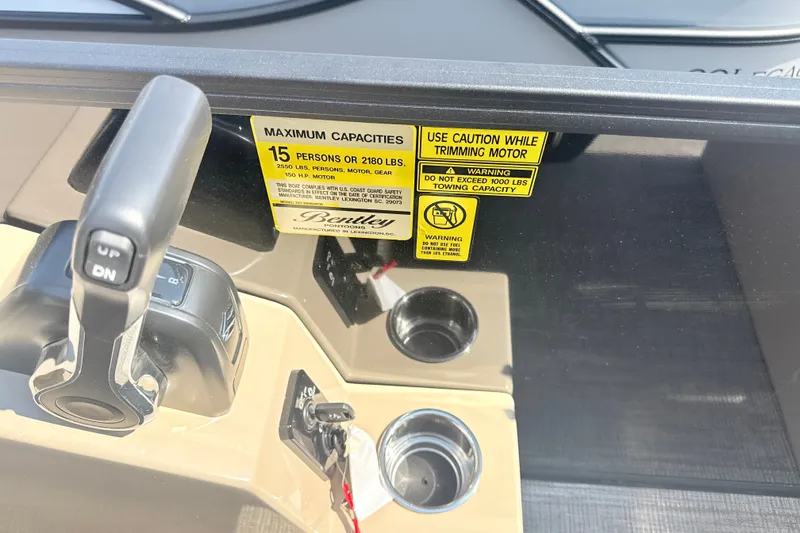 Slide: The Image of Control panel of 2026 Bentley Pontoons Legacy 220 Navigator with capacity warning label. - 18