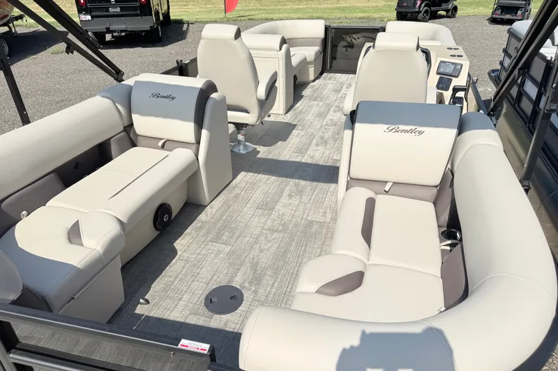 Slide: The Image of 2026 Bentley Pontoons Legacy 220 Navigator interior with luxurious seating and modern design. - 10