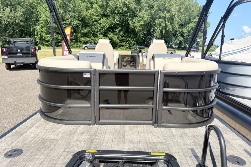 Slide: The Image of 2026 Bentley Pontoons Legacy 220 Navigator, sleek design, parked outdoors, showcasing luxury seating. - 3