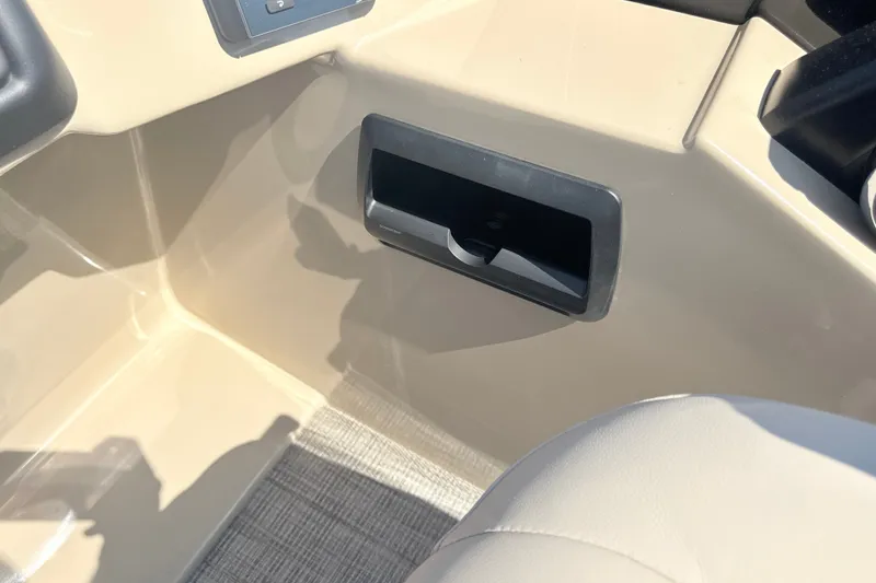 Slide: The Image of Interior detail of 2026 Bentley Pontoons Legacy 220 Navigator, featuring a storage compartment. - 19