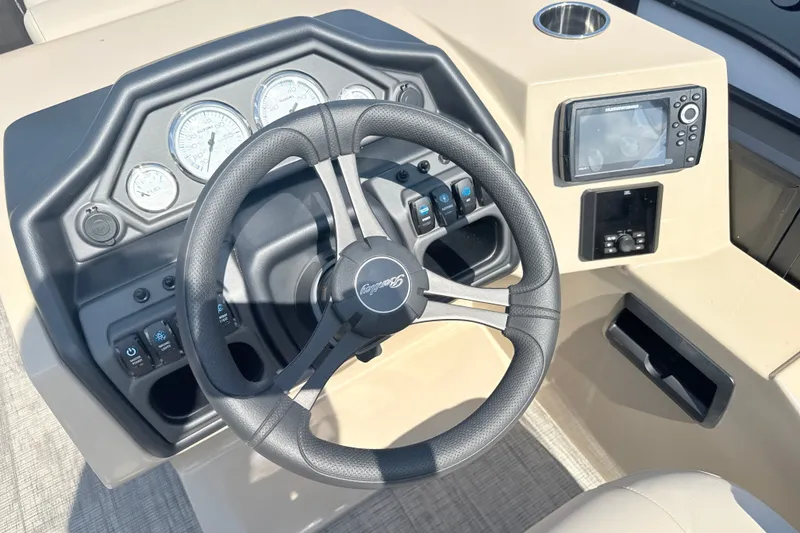 Slide: The Image of Steering console of 2026 Bentley Pontoons Legacy 220 Navigator with gauges and navigation system. - 17