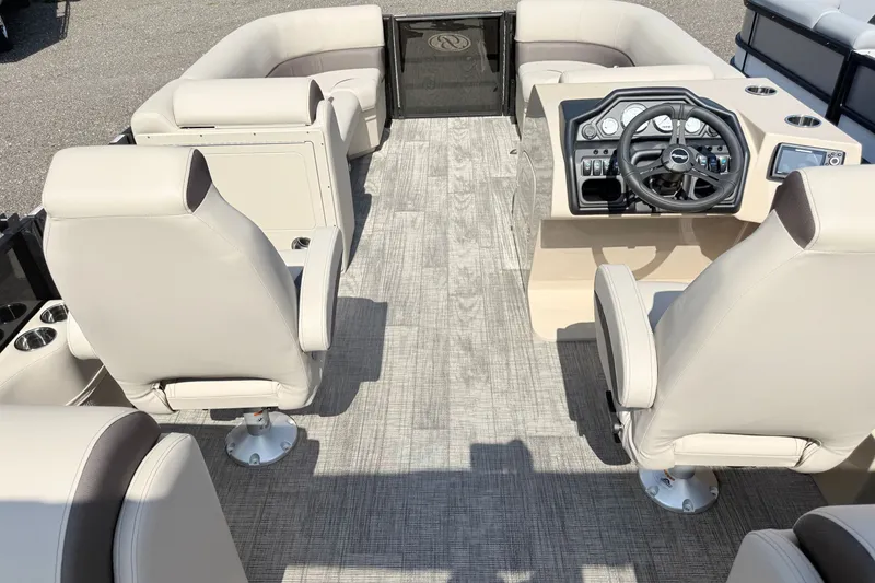 Slide: The Image of 2026 Bentley Pontoons Legacy 220 Navigator interior with plush seating and modern dashboard. - 8