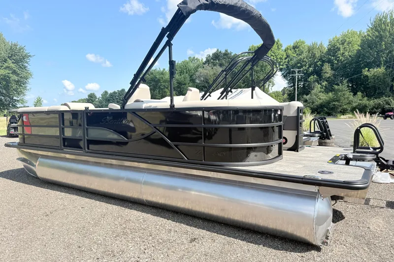 Slide: The Image of 2026 Bentley Pontoons Legacy 220 Navigator on a sunny day, showcasing sleek design. - 2