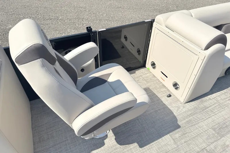 Slide: The Image of 2026 Bentley Pontoons Legacy 220 Navigator interior with plush seating and modern design. - 11