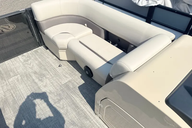 Slide: The Image of 2026 Bentley Pontoons Legacy 220 Navigator interior with beige seating and modern design. - 14