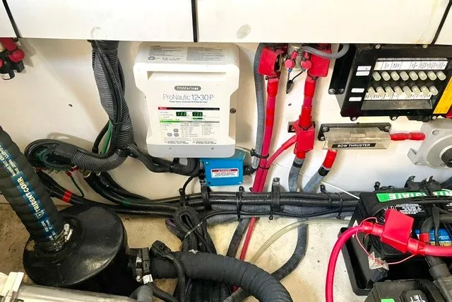 Slide: The Image of Engine compartment of a 2008 Sea Ray Sundancer 330 with electrical components and wiring. - 33