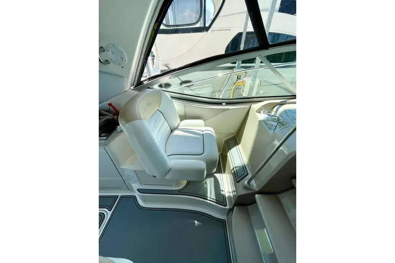 Slide: The Image of Interior of 2008 Sea Ray Sundancer 330, featuring a plush captain's chair and sleek design. - 15