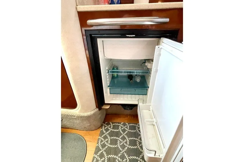 Slide: The Image of Open mini fridge inside 2008 Sea Ray Sundancer 330 yacht cabin. - 21