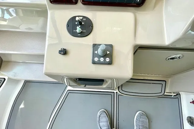 Slide: The Image of Control panel of a 2008 Sea Ray Sundancer 330 boat with joystick and switches. - 13