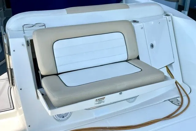 Slide: The Image of 2008 Sea Ray Sundancer 330 boat seating area with beige and white cushions. - 29