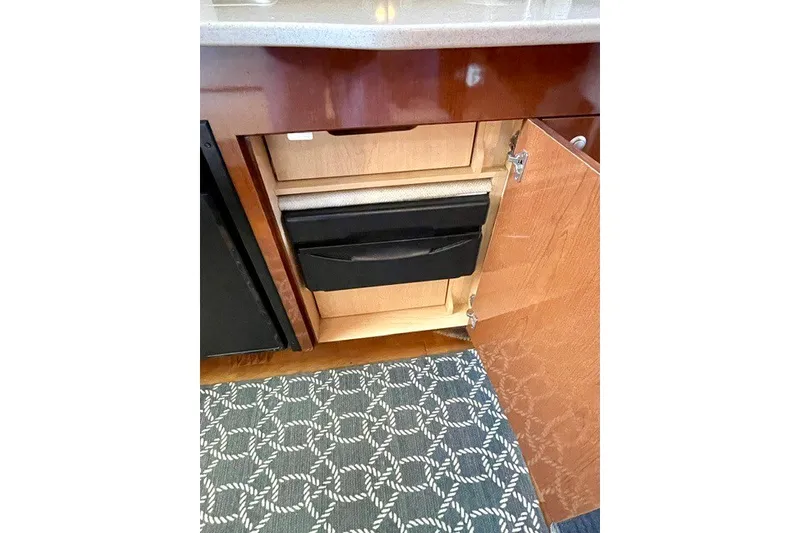 Slide: The Image of Open cabinet with drawers in 2008 Sea Ray Sundancer 330 yacht interior. - 20
