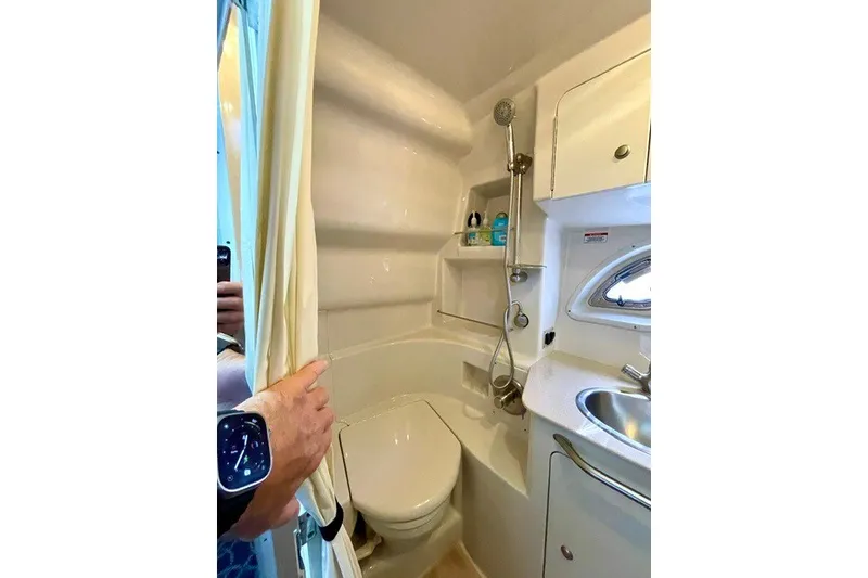 Slide: The Image of Compact bathroom in 2008 Sea Ray Sundancer 330 yacht with shower, toilet, and sink. - 28