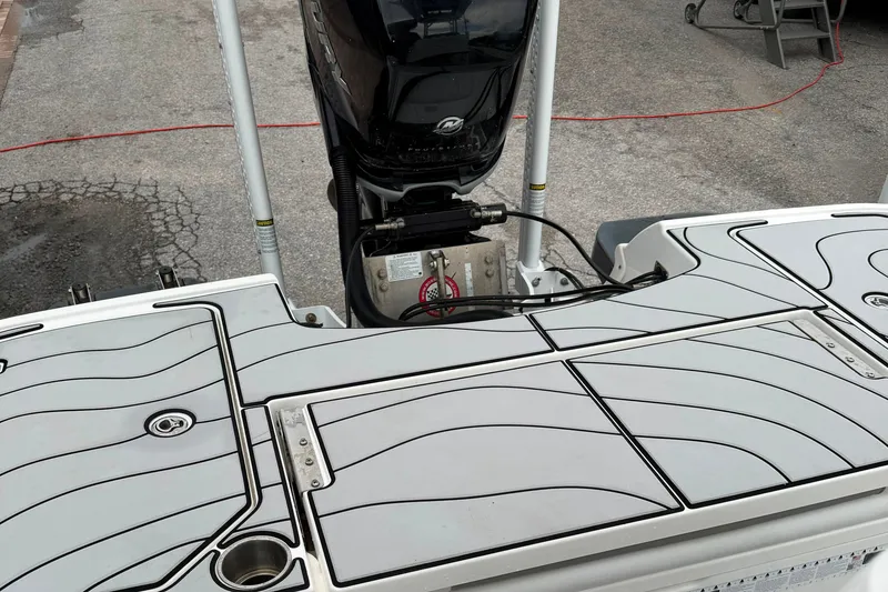 Slide: The Image of 2023 Caymas 26 HB boat deck with motor, featuring sleek design and modern fittings. - 6