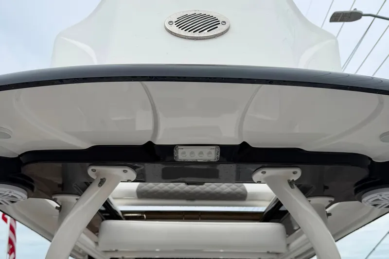 Slide: The Image of 2023 Caymas 26 HB boat roof with speaker and light detail. - 13