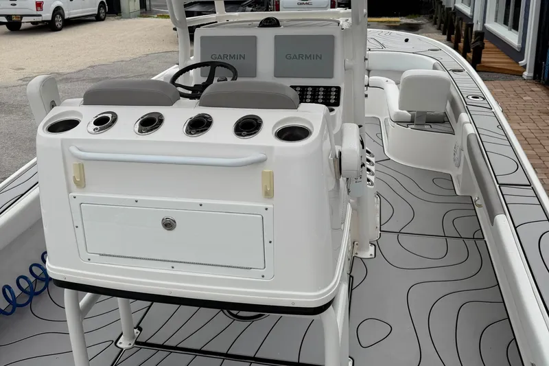 Slide: The Image of 2023 Caymas 26 HB boat interior with Garmin electronics and stylish deck design. - 7