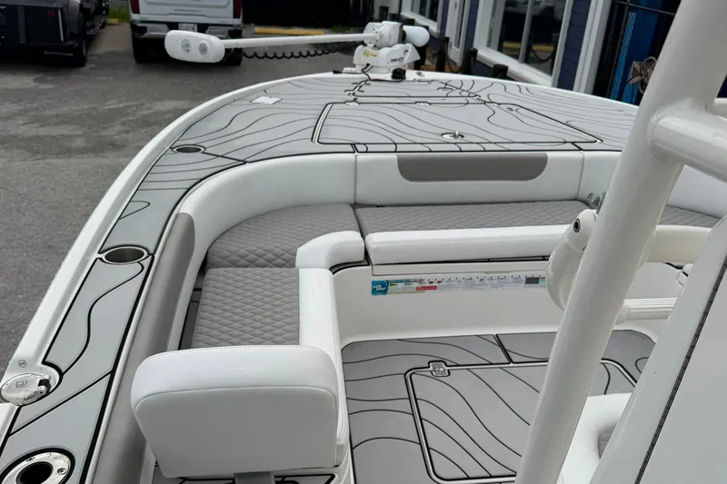 Slide: The Image of 2023 Caymas 26 HB boat interior with sleek seating and modern design. - 15