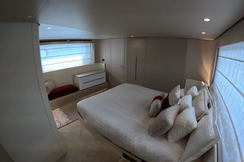 Slide: The Image of Luxurious bedroom interior of 2023 Azimut Fly 68 yacht with elegant decor and soft lighting. - 84
