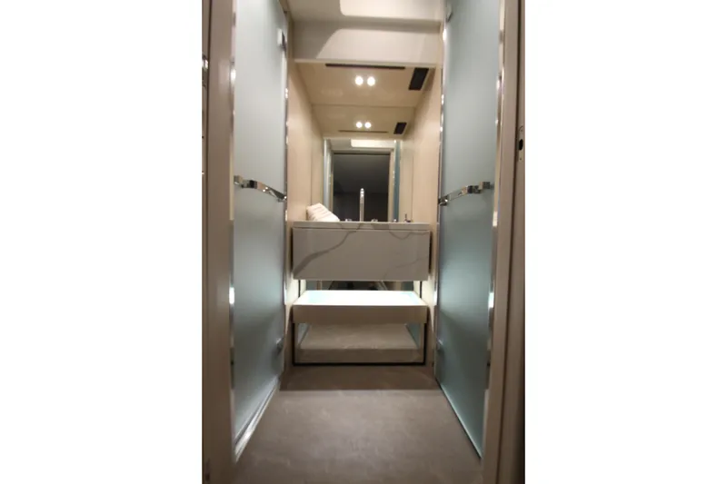 Slide: The Image of Luxurious interior of 2023 Azimut Fly 68 yacht, featuring modern design and elegant lighting. - 89