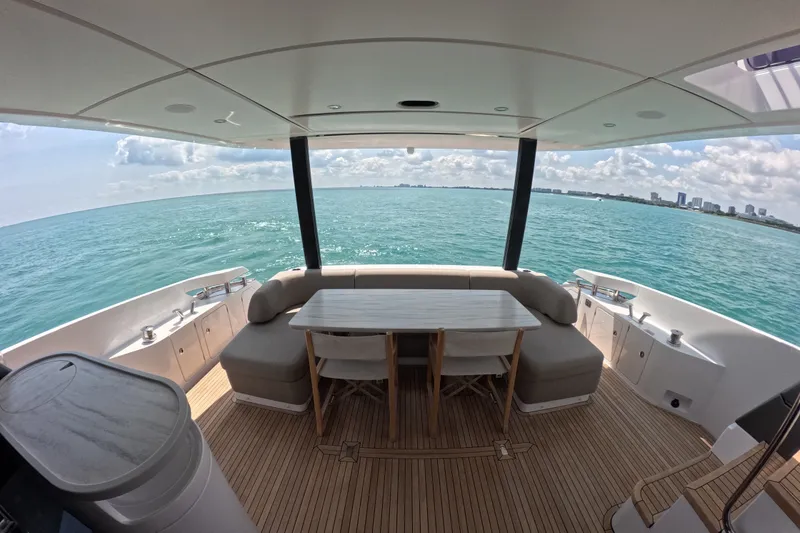 Slide: The Image of Luxurious 2023 Azimut Fly 68 yacht deck with ocean view and elegant seating area. - 18