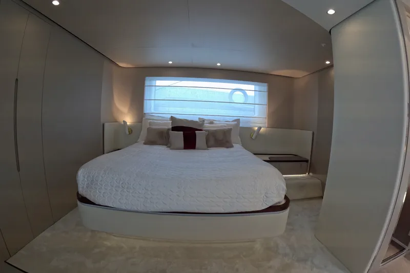 Slide: The Image of Luxurious bedroom interior of 2023 Azimut Fly 68 yacht, featuring elegant design and cozy bedding. - 90