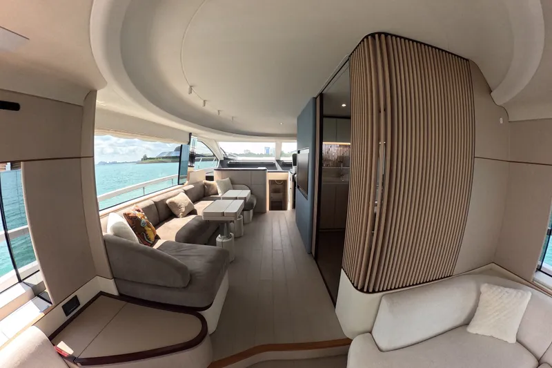 Slide: The Image of Luxurious interior of 2023 Azimut Fly 68 yacht with elegant seating and panoramic windows. - 43