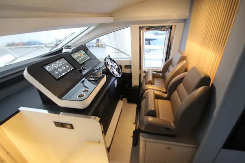 Slide: The Image of Interior helm of 2023 Azimut Fly 68 yacht with modern controls and seating. - 66