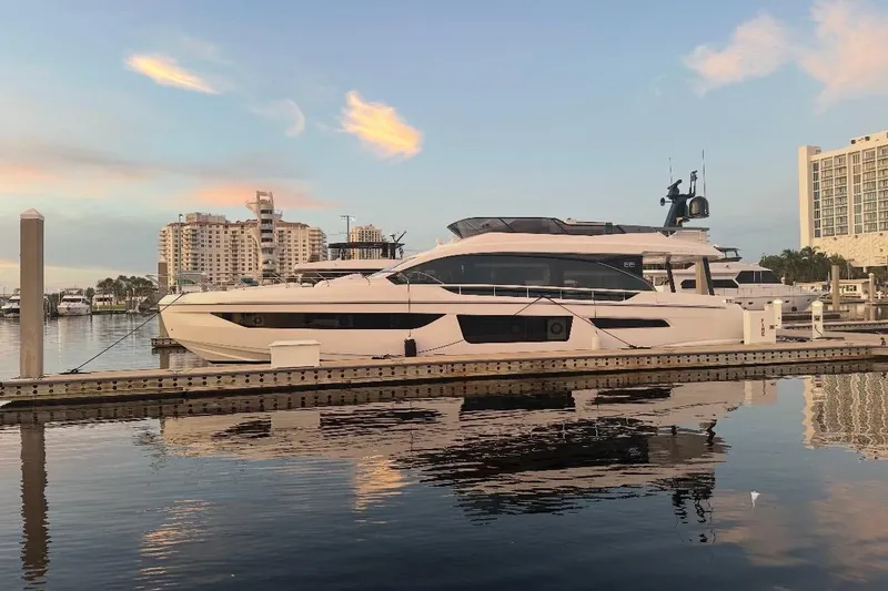 Slide: The Image of Luxury Azimut Fly 68 yacht docked at marina, 2023 model, reflecting on calm water. - 127