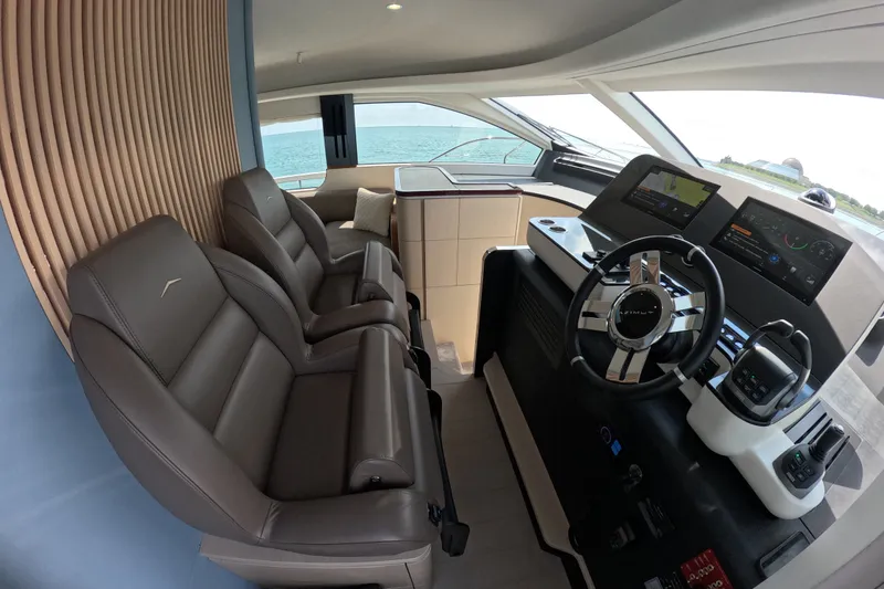 Slide: The Image of Luxurious interior of 2023 Azimut Fly 68 yacht with modern helm and leather seating. - 63