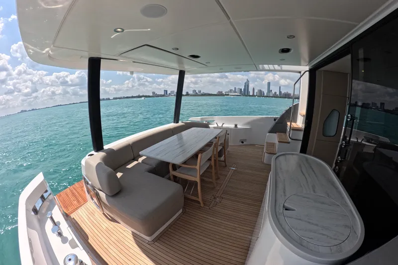 Slide: The Image of Luxurious 2023 Azimut Fly 68 yacht deck with city skyline view. - 16