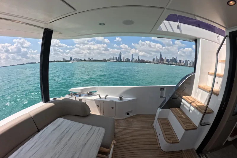 Slide: The Image of Luxurious 2023 Azimut Fly 68 yacht interior with city skyline view. - 17