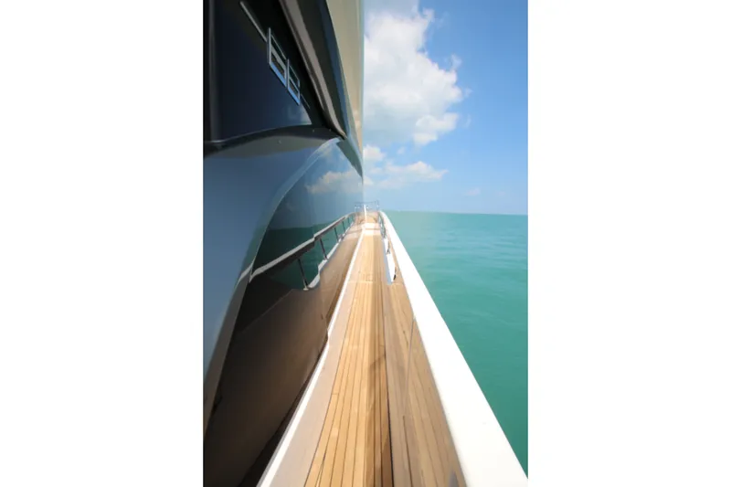 Slide: The Image of Side view of 2023 Azimut Fly 68 yacht on calm blue sea under clear sky. - 32