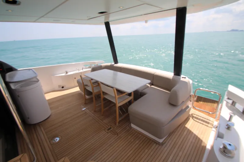 Slide: The Image of Luxurious 2023 Azimut Fly 68 yacht deck with elegant seating and ocean view. - 21
