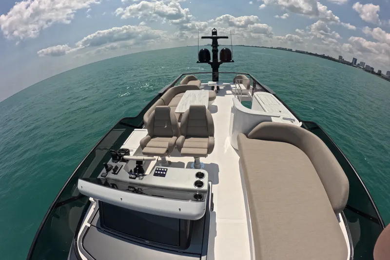 Slide: The Image of 2023 Azimut Fly 68 yacht on open sea, featuring luxurious deck seating. - 36