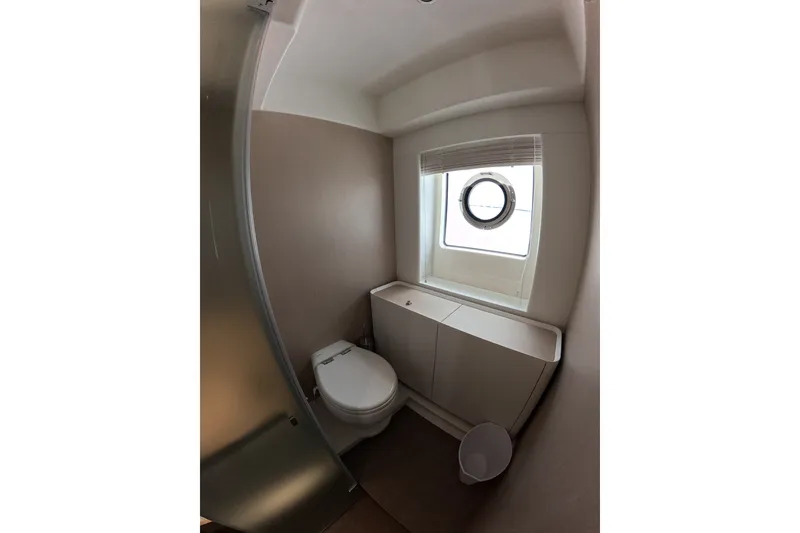 Slide: The Image of Modern bathroom in 2023 Azimut Fly 68 yacht with porthole window and sleek design. - 92