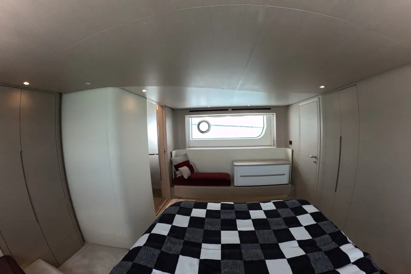 Slide: The Image of Luxurious interior of 2023 Azimut Fly 68 yacht with modern design and checkered bedding. - 86