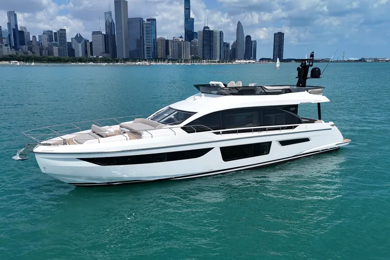 The Image of 2023 Azimut Fly 68 yacht cruising on turquoise water with city skyline backdrop. - 0