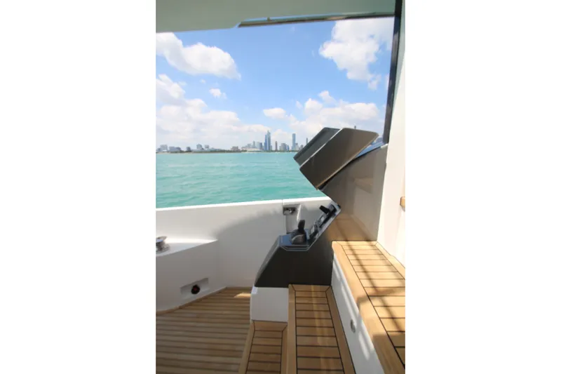 Slide: The Image of Azimut Fly 68 yacht deck with city skyline view, 2023 model. - 22