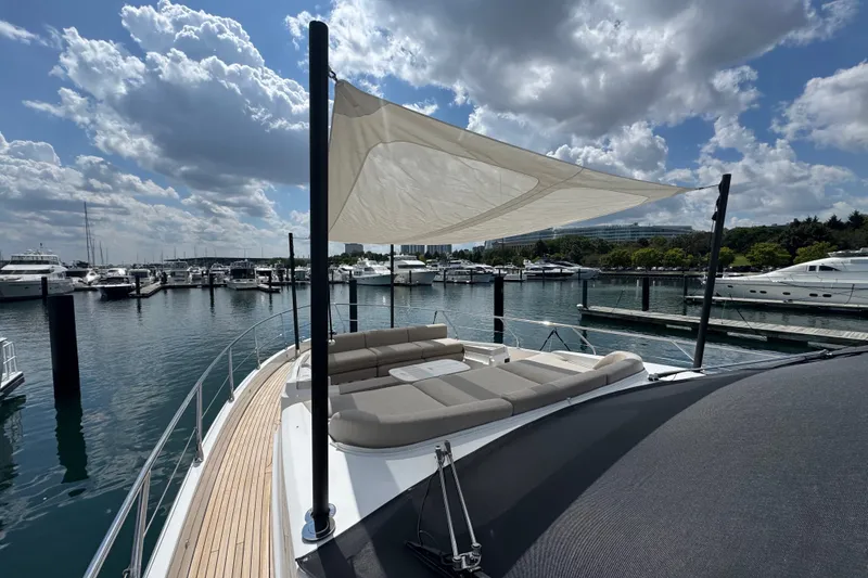 Slide: The Image of Luxurious 2023 Azimut Fly 68 yacht docked at marina under cloudy sky. - 162